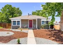 Charming one-story home with a red front door, awnings, and creative gravel landscaping at 951 S Osage St, Denver, CO 80223