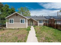 Charming single-story home featuring solar panels and a walkway leading to the front door at 3629 W Custer Pl, Denver, CO 80219