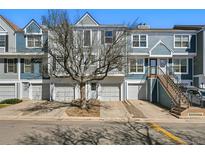 Charming townhome with eye-catching curb appeal, private garages, and inviting entryways at 1699 S Trenton St # 147, Denver, CO 80231