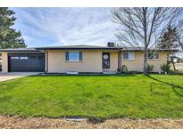 Charming ranch-style home with a well-manicured lawn and inviting curb appeal at 16816 E Costilla Ave, Foxfield, CO 80016