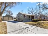 Charming single-story home with a well-maintained front yard and detached garage, offers curb appeal and convenience at 4546 S Logan St, Englewood, CO 80113