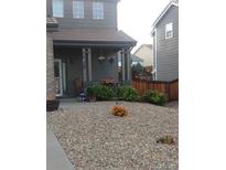 Charming home with a well-kept xeriscaped front yard, perfect for low-maintenance living at 10540 Tracewood Cir, Highlands Ranch, CO 80130