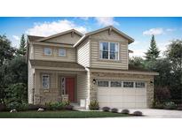 Charming two-story home with stone accents, a red front door, and a spacious two-car garage at 683 N Deer Park St, Watkins, CO 80137
