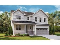 Charming two-story home with neutral siding, manicured lawn, and attached two-car garage in a serene community at 661 Split Rock Dr, Erie, CO 80516