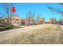 Charming single-story home with a well-maintained front yard and mature trees at 23317 E Saratoga Cir, Aurora, CO 80016