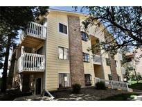 Inviting condo building featuring brick accents and private balconies perfect for relaxing and enjoying the outdoors at 12512 E Cornell Ave # 101, Aurora, CO 80014