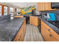 Spacious kitchen with a large countertop and stainless steel appliances at 951 S Fulton St, Aurora, CO 80247