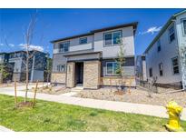 Attractive two-story home featuring stone accents, landscaped front yard, and modern design at 23951 E 40Th Ave, Aurora, CO 80019
