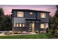 Two-story home with gray siding, stone accents, and landscaping at 23951 E 40Th Ave, Aurora, CO 80019