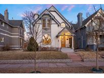 Charming two-story home featuring a well-maintained lawn and classic architectural details in a desirable neighborhood at 564 S Grant St, Denver, CO 80209