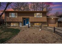 Charming two-story home featuring a split-level design and a well-maintained front yard with attractive stone landscaping at 1529 Ashcroft Dr, Longmont, CO 80501