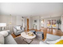 Bright living room with hardwood floors, comfortable seating, and stylish decor at 1529 Ashcroft Dr, Longmont, CO 80501