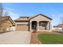 Charming single-Gathering home with a well-manicured lawn and attached two-car garage with a beautiful exterior at 19543 E 54Th Ave, Denver, CO 80249