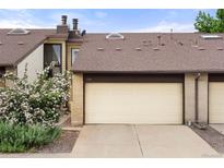 Charming townhome with a two car garage and manicured landscaping at 1159 S Otis Pl, Lakewood, CO 80232