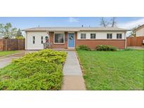 Charming single-story home with a brick facade and well-maintained lawn, with a walkway leading to the front door at 3100 W 94Th Ave, Westminster, CO 80031