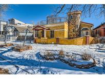 Unique two-story home with stone accents and a charming front yard at 438 Inca St, Denver, CO 80204