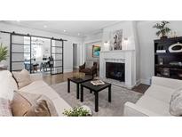 Bright living room features a fireplace and comfortable seating at 885 S Sherman St, Denver, CO 80209