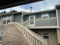 Inviting condo exterior featuring a private balcony, well-maintained siding, and convenient stair access at 2690 E Otero Pl # 7, Centennial, CO 80122