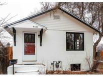 Charming single-story home featuring a white exterior, classic roofline, and inviting front entrance at 4430 S Cherokee St, Englewood, CO 80110