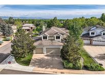 Stunning two-story home with a three-car garage, mature trees and meticulous landscaping at 360 Morning Star Ln, Lafayette, CO 80026