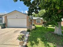 Charming single Gathering home featuring a two-car garage and a well-maintained front yard at 45 Pierce St, Lakewood, CO 80226