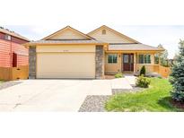 Inviting single-Gathering home featuring a two-car garage and well-maintained front lawn at 2140 Santa Fe Dr, Longmont, CO 80504