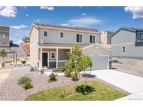 Charming two-story home with a well-maintained yard and inviting front porch, perfect for enjoying the neighborhood view at 42741 Ivydel Cir, Elizabeth, CO 80107