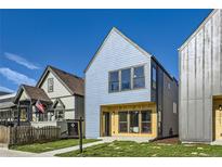 Charming two-story home with light blue siding, modern windows, and a well-maintained front lawn at 3725 N Franklin St, Denver, CO 80205