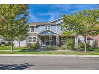 Charming two-story home with stone accents, covered porch, and well-maintained landscaping at 1133 S Richfield St, Aurora, CO 80017