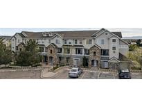 Charming townhouse with stone accents and a well-maintained front exterior in a desirable community at 479 Black Feather Loop # 311, Castle Rock, CO 80104
