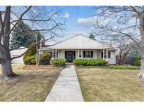 Inviting front entrance with a covered porch and neatly trimmed bushes at 3201 S Albion St, Denver, CO 80222