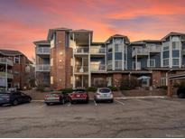 Exterior shot of building with a brick facade and multiple floors, parking in front at 2428 W 82Nd Pl # 2D, Westminster, CO 80031