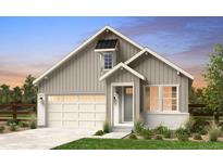 Charming, modern two-story home showcasing neutral colors, attached two-car garage, and a welcoming entrance at 16517 W 92Nd Pl, Arvada, CO 80007