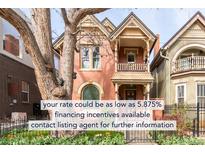Charming two-story home with a large tree and a well-maintained front yard at 3147 Vallejo St, Denver, CO 80211