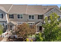 Charming townhome with inviting curb appeal and well-maintained landscaping at 1522 Chimney Peak Dr, Castle Rock, CO 80109