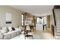 Open floor plan boasts modern kitchen with island and adjacent living area at 4640 Tennyson St # 29, Denver, CO 80212