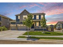 Charming two-story home features a well-kept yard and a spacious three-car garage at 10991 Xanadu St, Commerce City, CO 80022