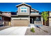 Charming two-story home with a well-manicured lawn, a two-car garage, and a welcoming front porch at 947 W Beverly St, Elizabeth, CO 80107