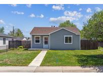 Charming single-story home featuring a well-maintained lawn, and quaint curb appeal at 2340 Geneva, Aurora, CO 80010