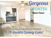 Inviting open floor plan featuring gorgeous updates and brand new, energy-efficient windows at 320 S Ames St # 5, Lakewood, CO 80226