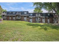 Brick exterior with private balconies and a spacious lawn offers a serene living environment at 140 E Highline Cir # 304, Centennial, CO 80122