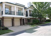 Inviting condo with charming balconies, front-facing garages and attractive brick accents at 1659 Harris St, Superior, CO 80027