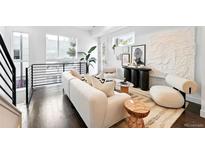 Bright living room with modern decor, hardwood floors, and natural light at 2830 W 32Nd Ave, Denver, CO 80211