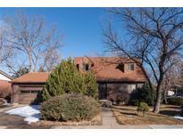 Charming two-story home with a brick facade and a well-maintained front yard in a quiet neighborhood at 1996 S Linden Ct, Denver, CO 80224