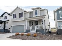 Charming two-story home showcasing a modern design, a well-kept yard, and an attached single car garage at 695 Simmental Loop, Castle Rock, CO 80104