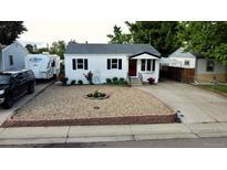 Charming home with manicured rock garden, well-maintained lawn, and RV parking at 3111 W Bails Pl, Denver, CO 80219