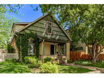 Charming home with a welcoming front porch and beautiful landscaping, inviting you to relax and enjoy the outdoors at 368 S Humboldt St, Denver, CO 80209
