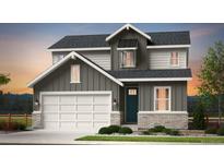 Charming two-story home with a welcoming facade, a two car garage, and meticulous landscaping at 3343 N Catawba Way, Aurora, CO 80019