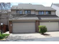 Two-story home with an attached two-car garage and a well-maintained front yard at 155 Xenon St # 33, Denver, CO 80228