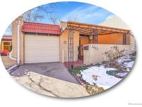 Brick ranch home with attached garage and covered entryway at 2665 S Sheridan Ct, Lakewood, CO 80227